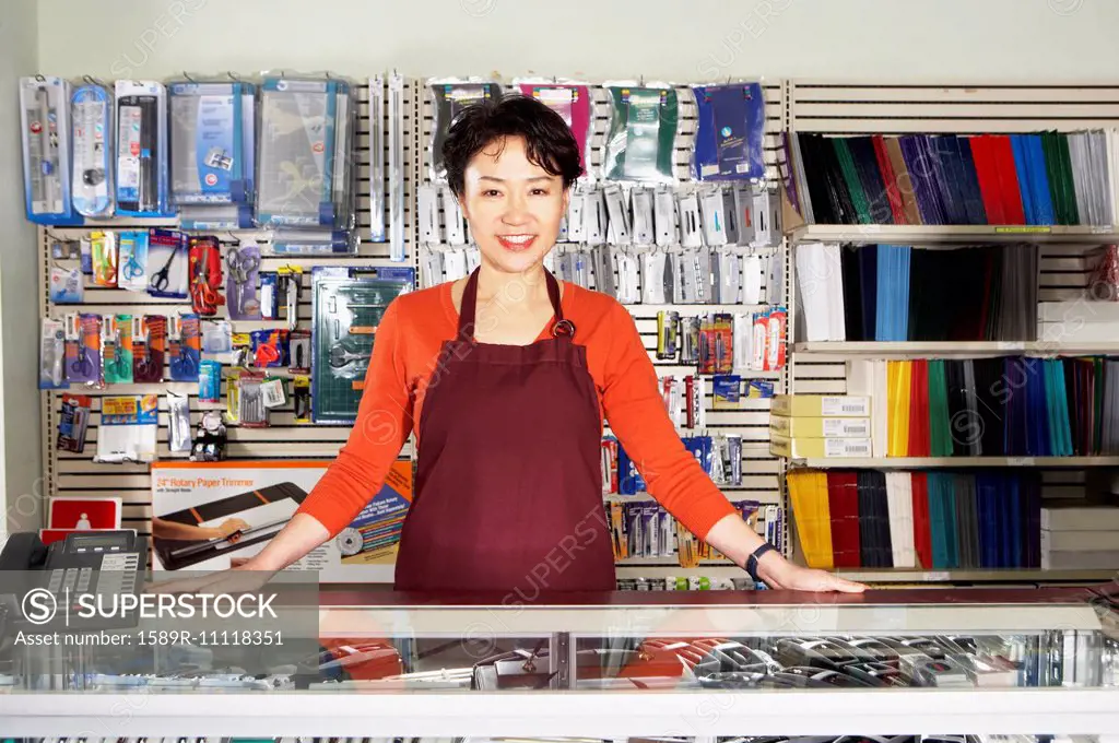 Chinese woman working in office supply store