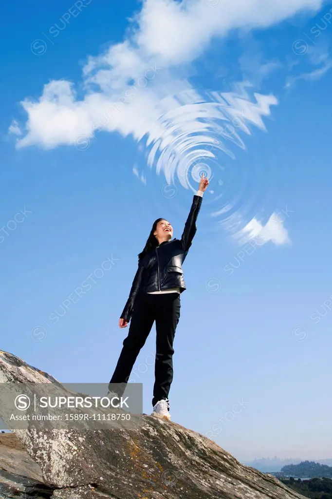 Asian woman making ripples in sky