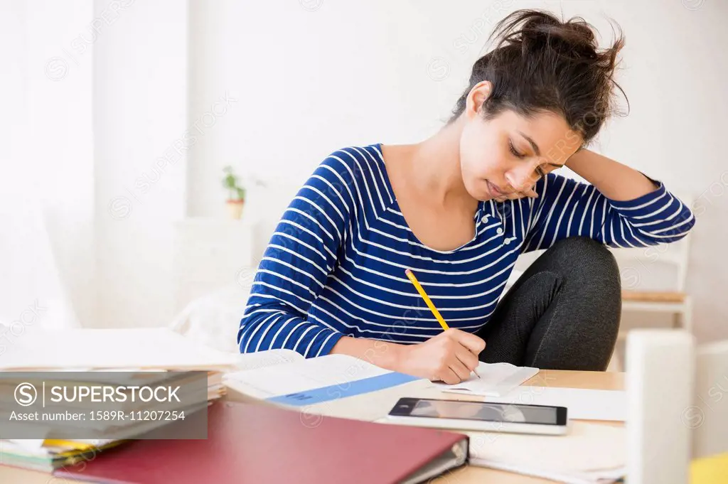 Asian student studying at table