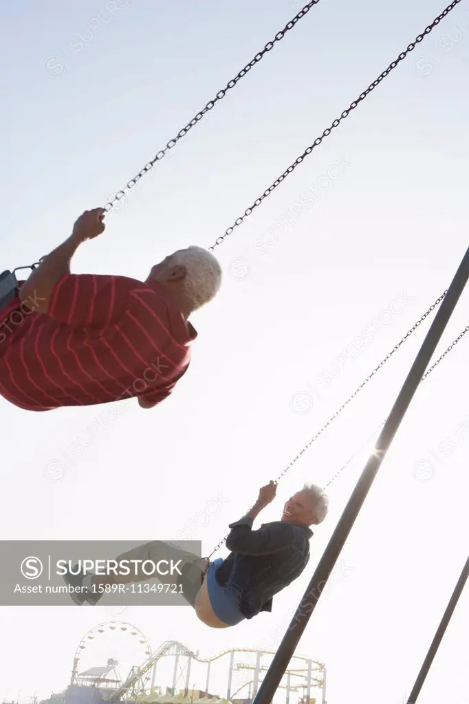 Senior African American couple on swing set