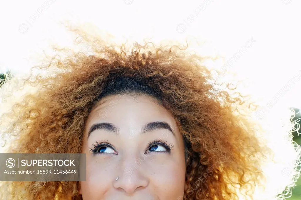 Close up of Hispanic woman looking up