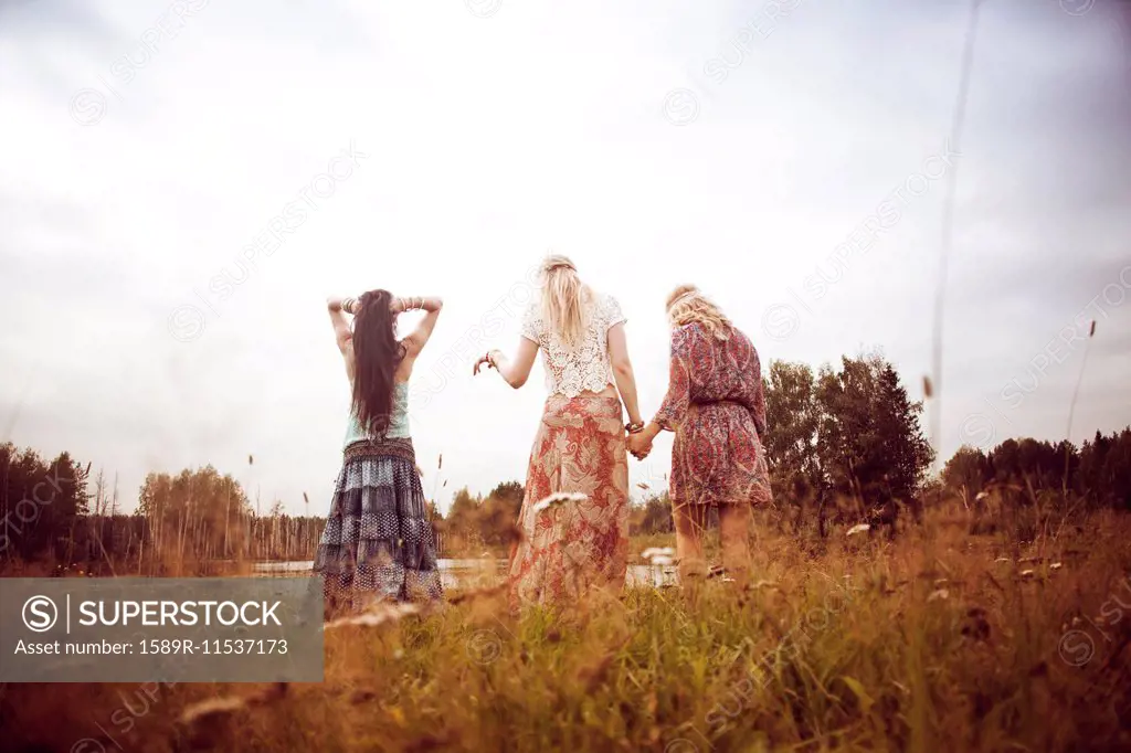Caucasian women standing in field