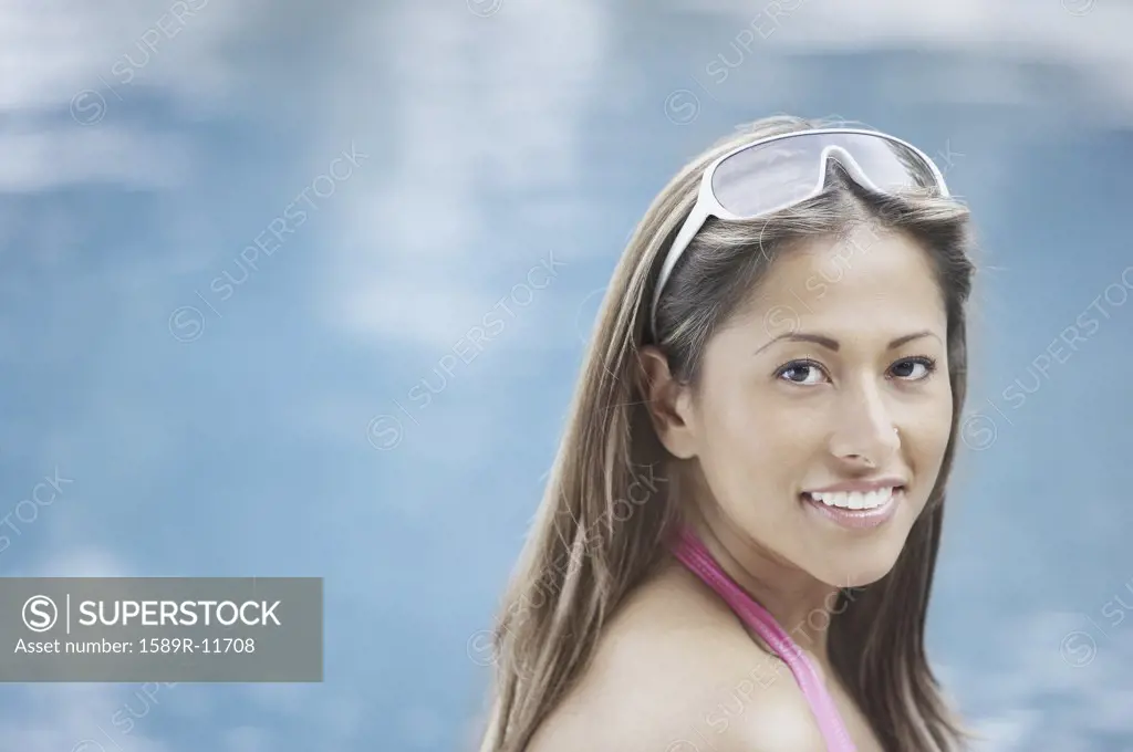 Smiling young woman in swimwear