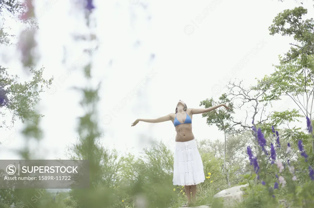 Woman standing with outstretched arms