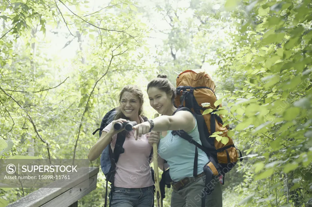 Young women hiking together in a forest