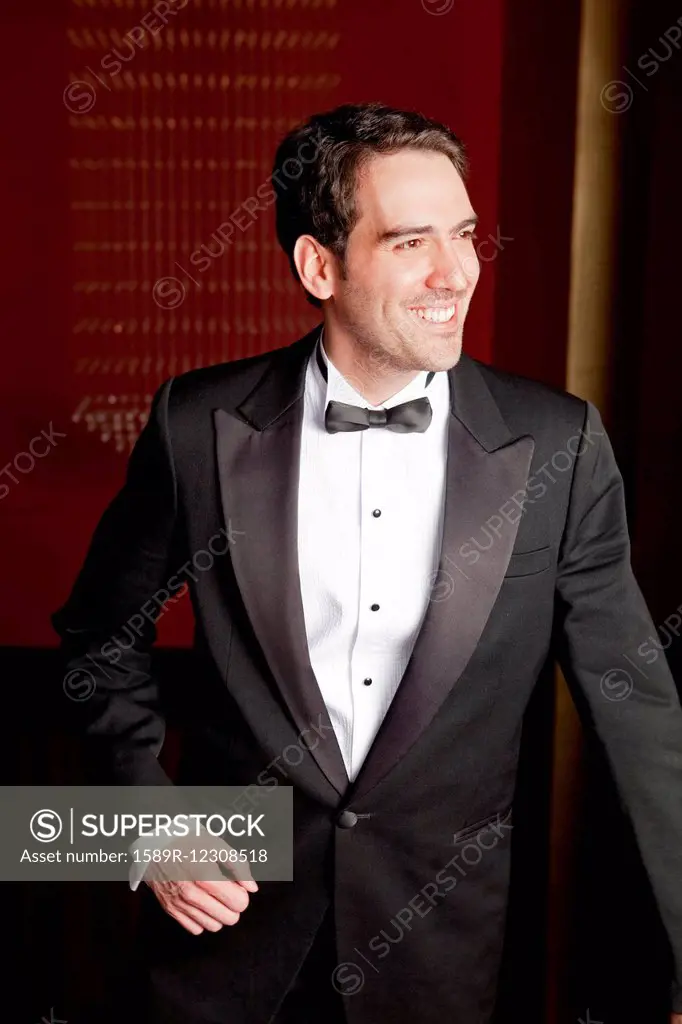 Elegant Hispanic man in tuxedo