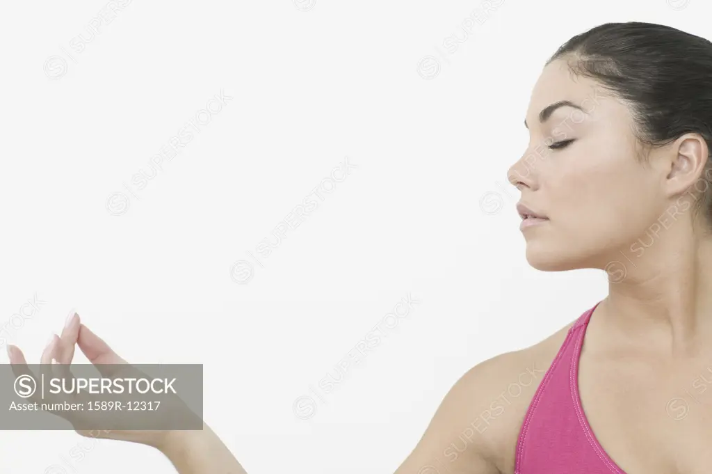 Side view of teen girl in meditation