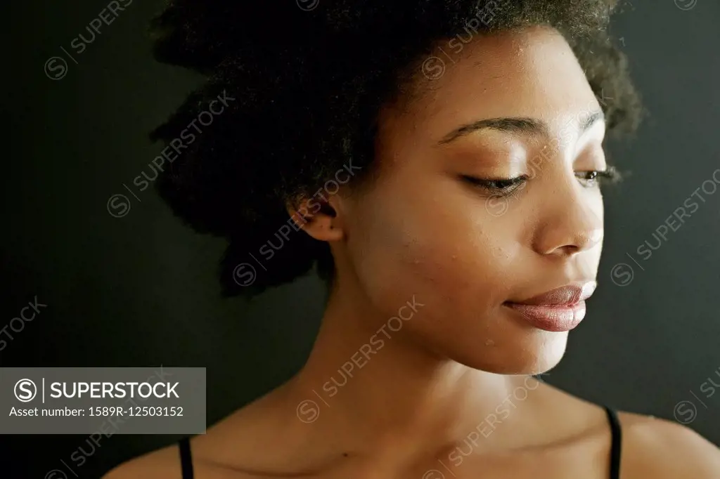 Close up of smiling black woman looking down