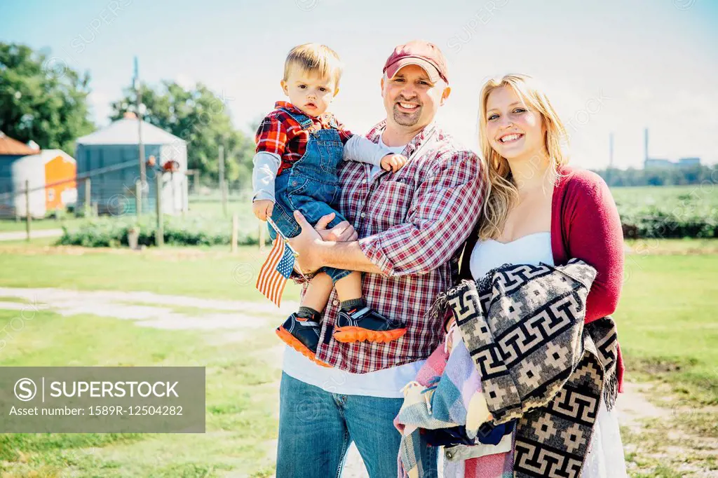 Caucasian family smiling on farm
