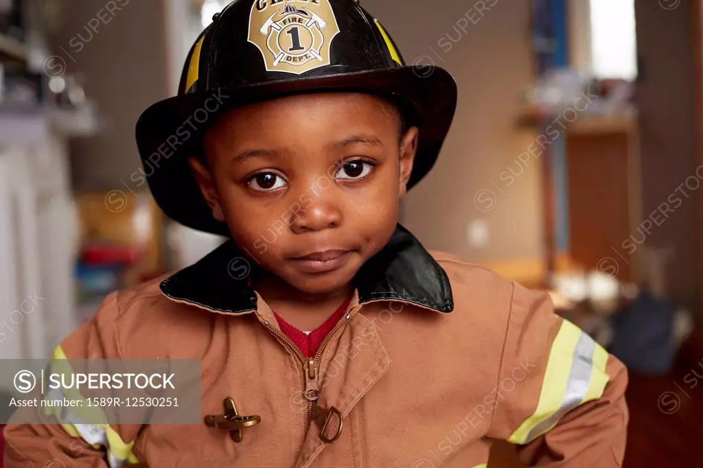 Black boy wearing firefighter Halloween costume