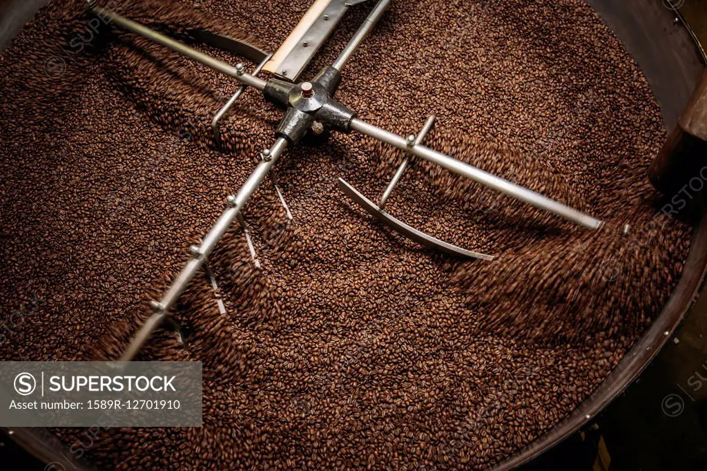 High angle view of equipment and beans in coffee roaster