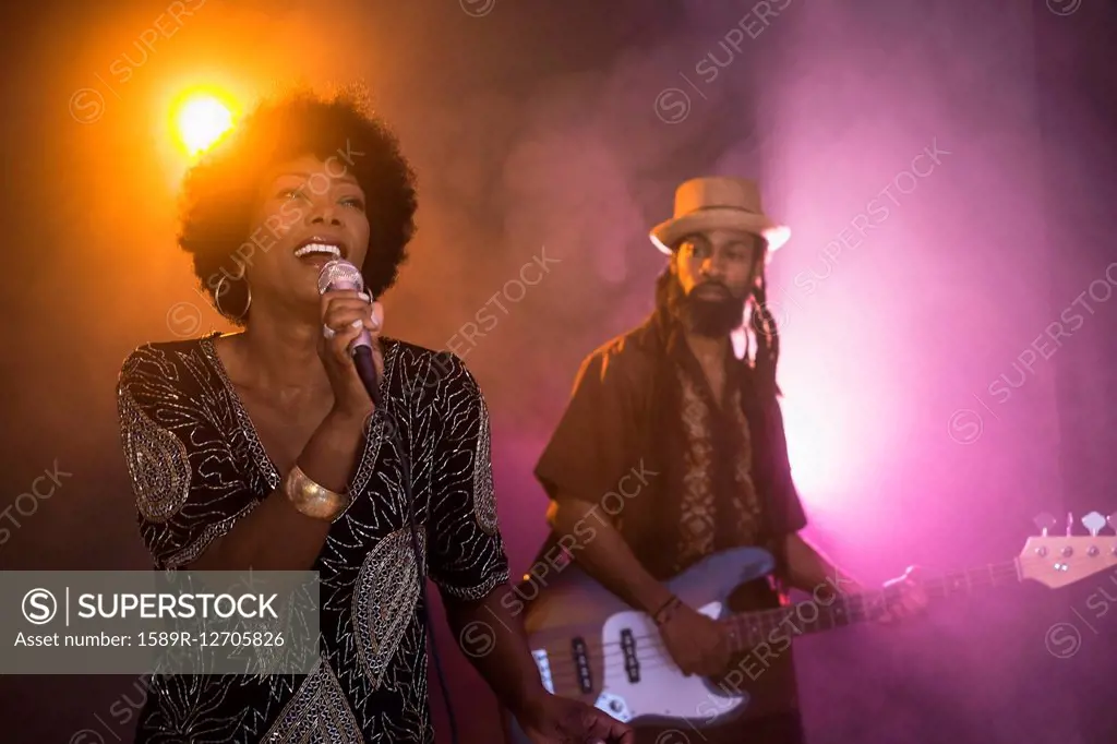 Singer and guitarist performing on stage