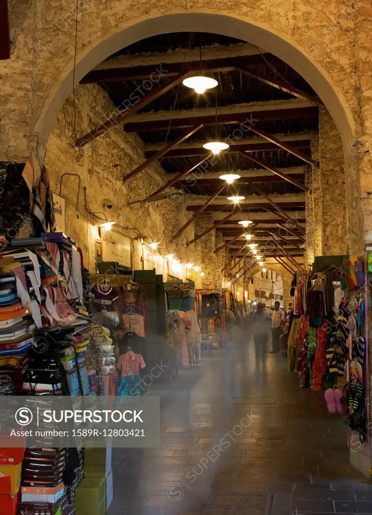 Blurred view of people shopping in indoor market