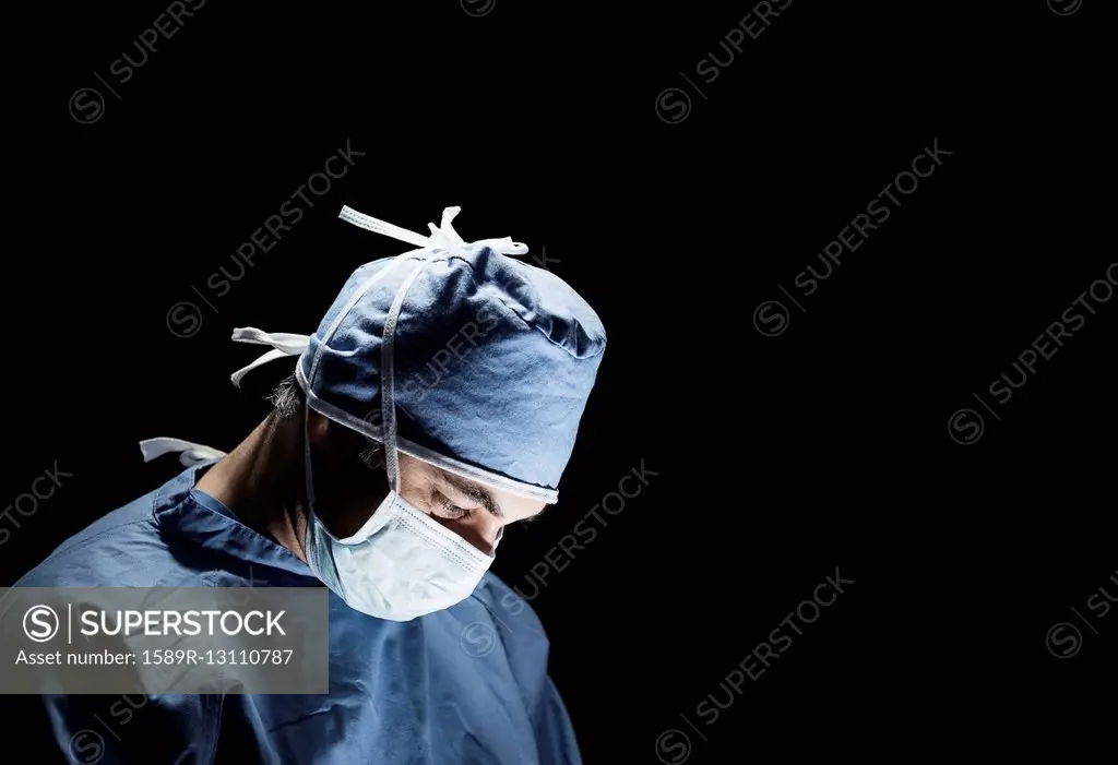 Mixed race surgeon working in operating room