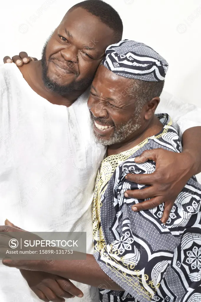 African American father and son hugging