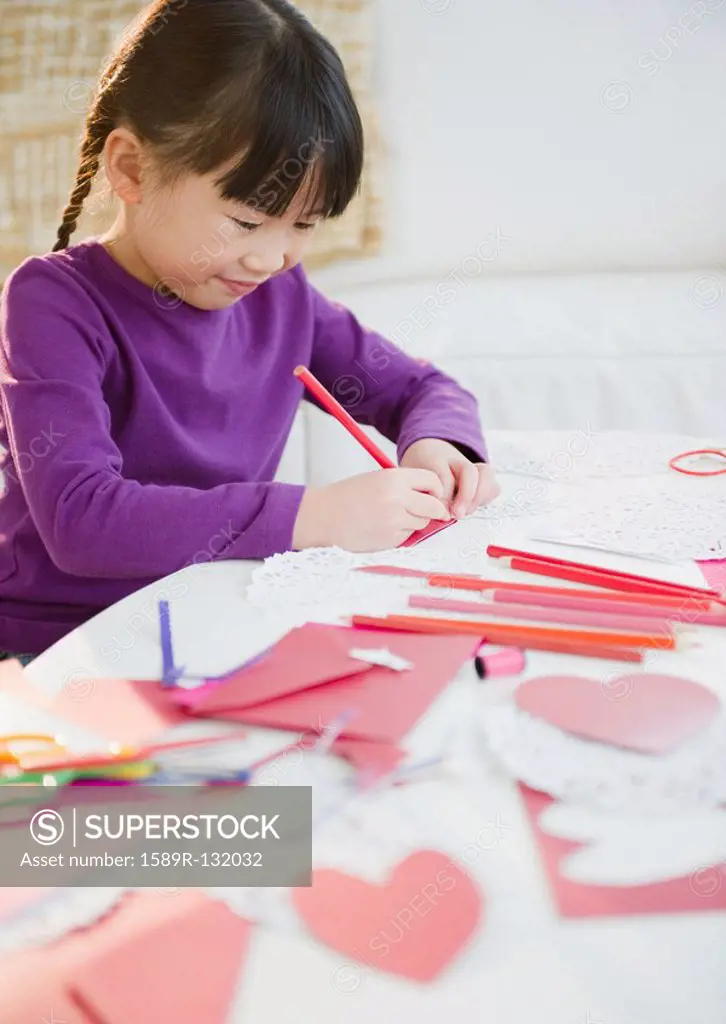 Chinese girl making Valentine´s Day cards
