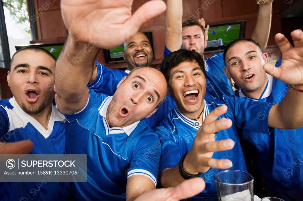 Cheering teammates in sports bar
