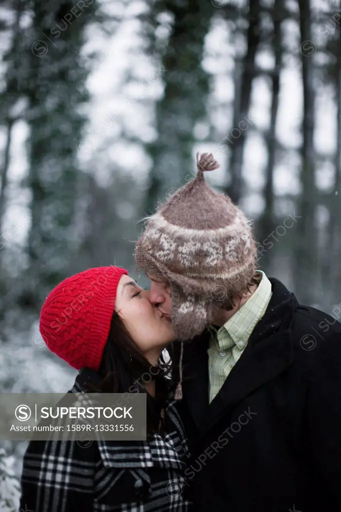 Couple kissing outdoors