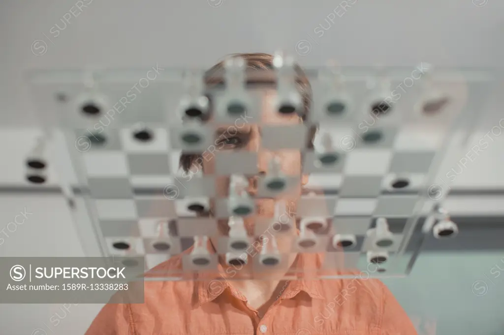 Caucasian man playing chess