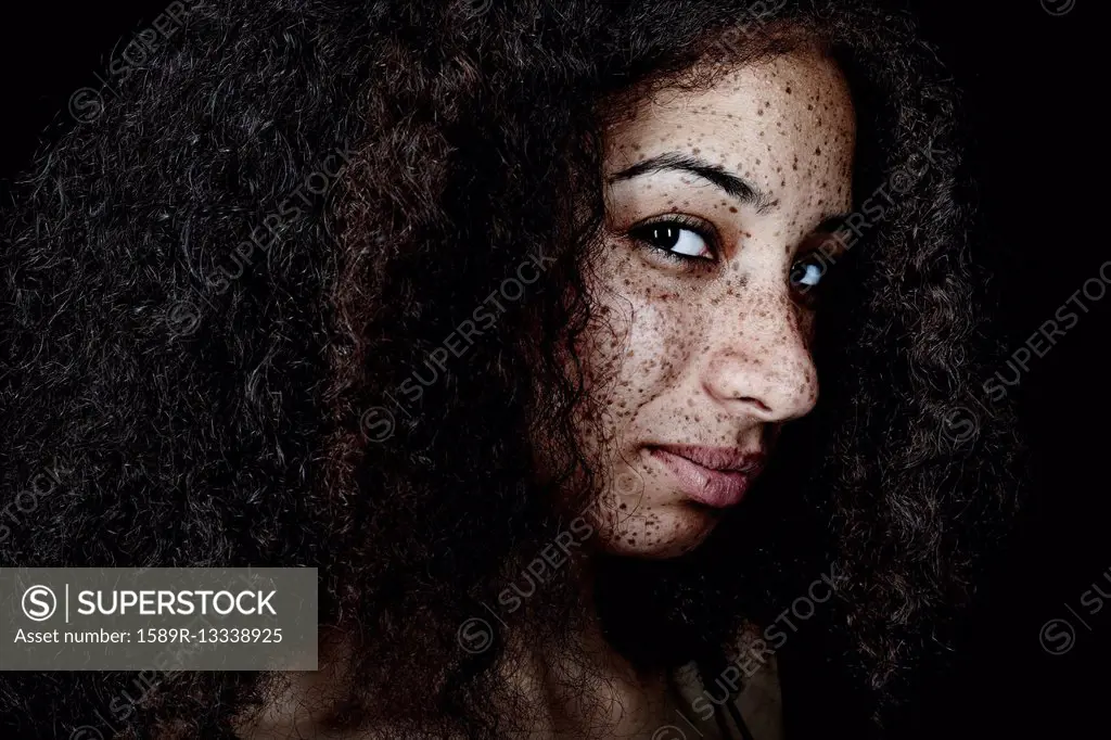 Freckled mixed race woman