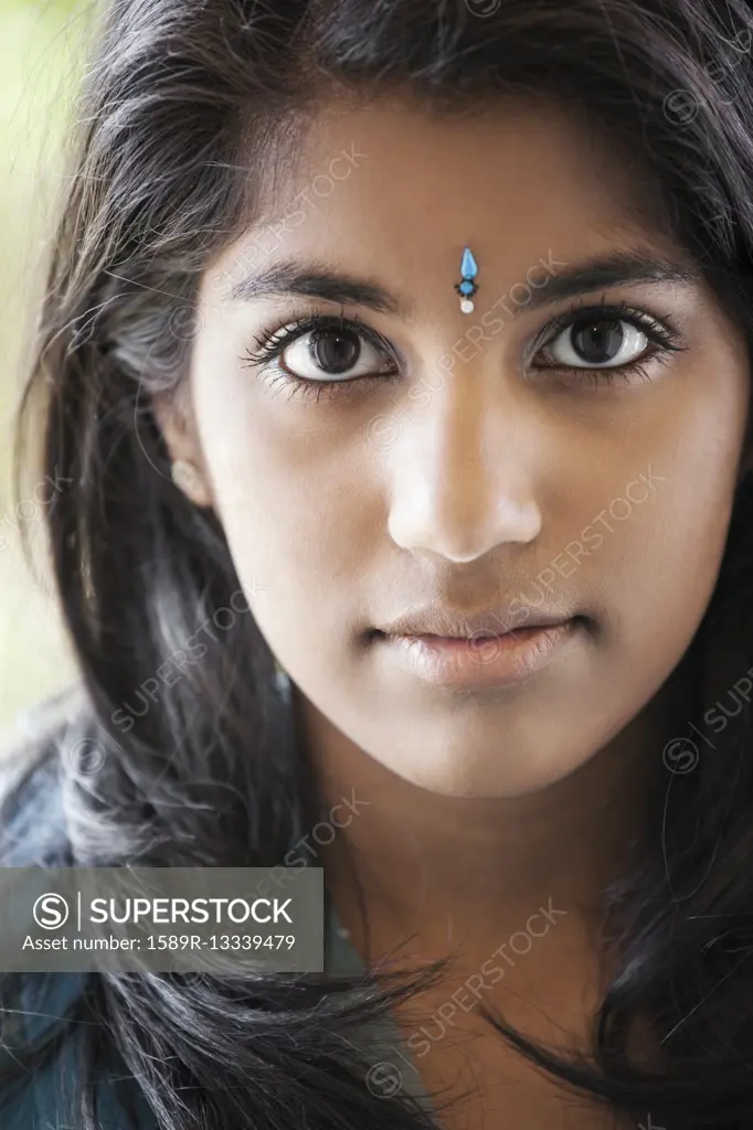 Indian woman with traditional jewel on forehead