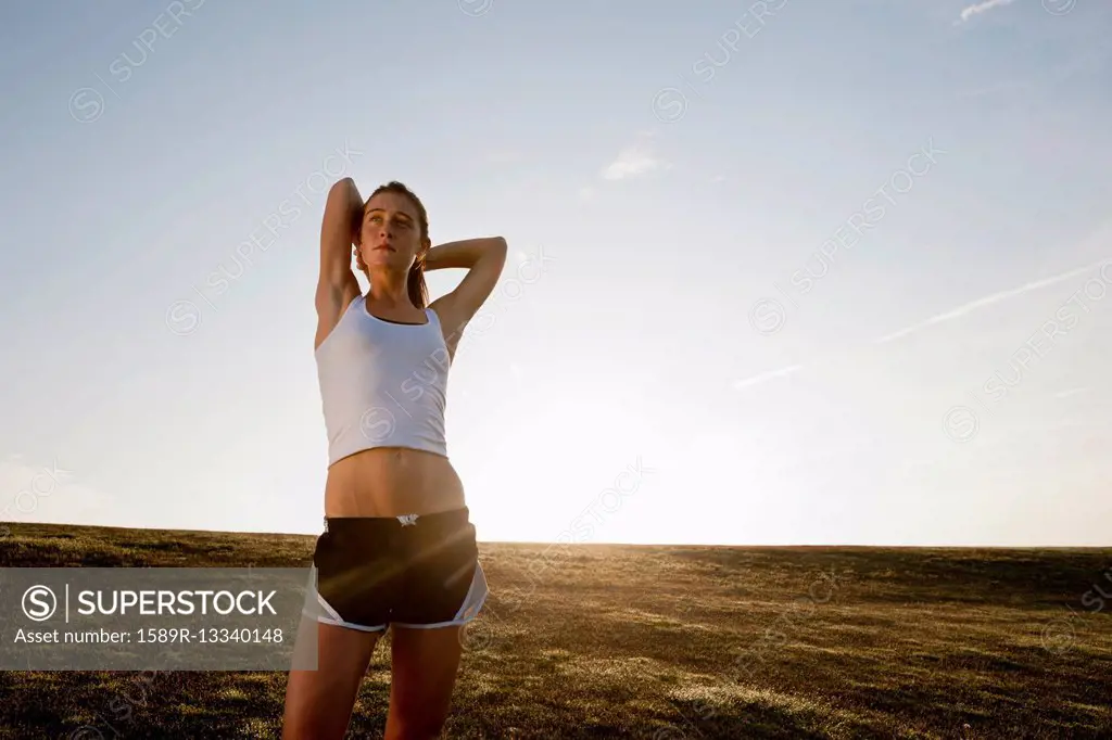 Caucasian runner stretching before exercise
