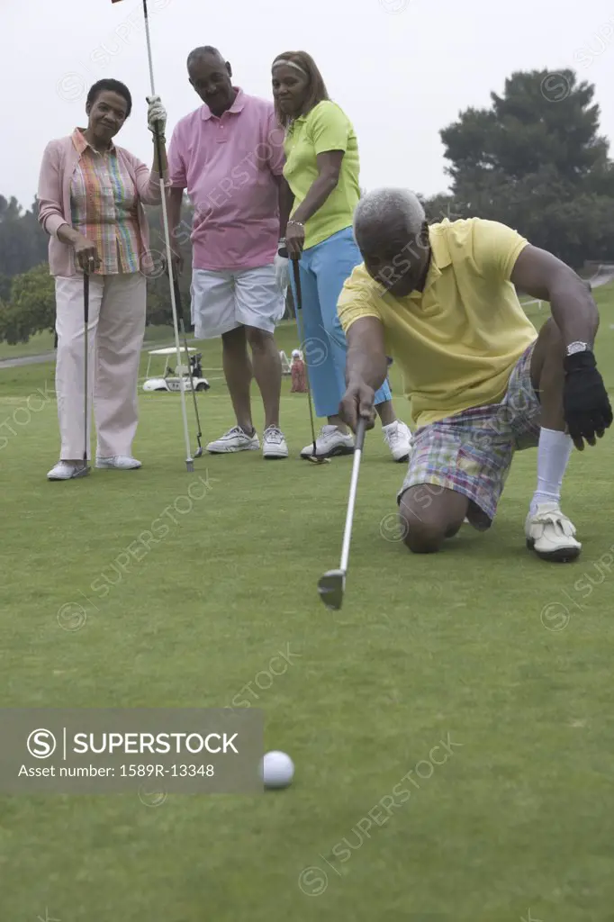 Senior man devising golfing strategy