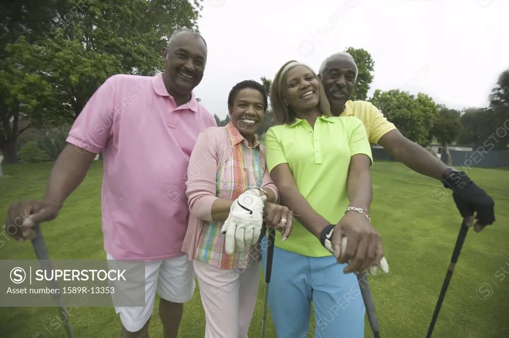 Two couples playing golf together