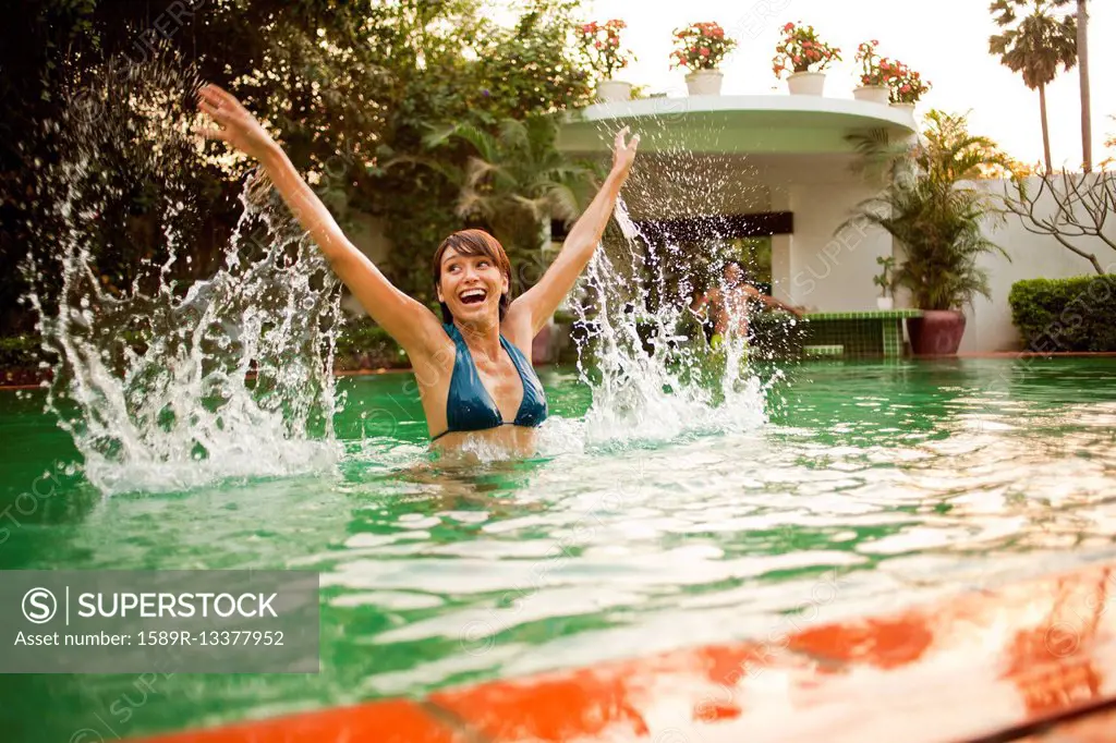 Woman playing in swimming pool