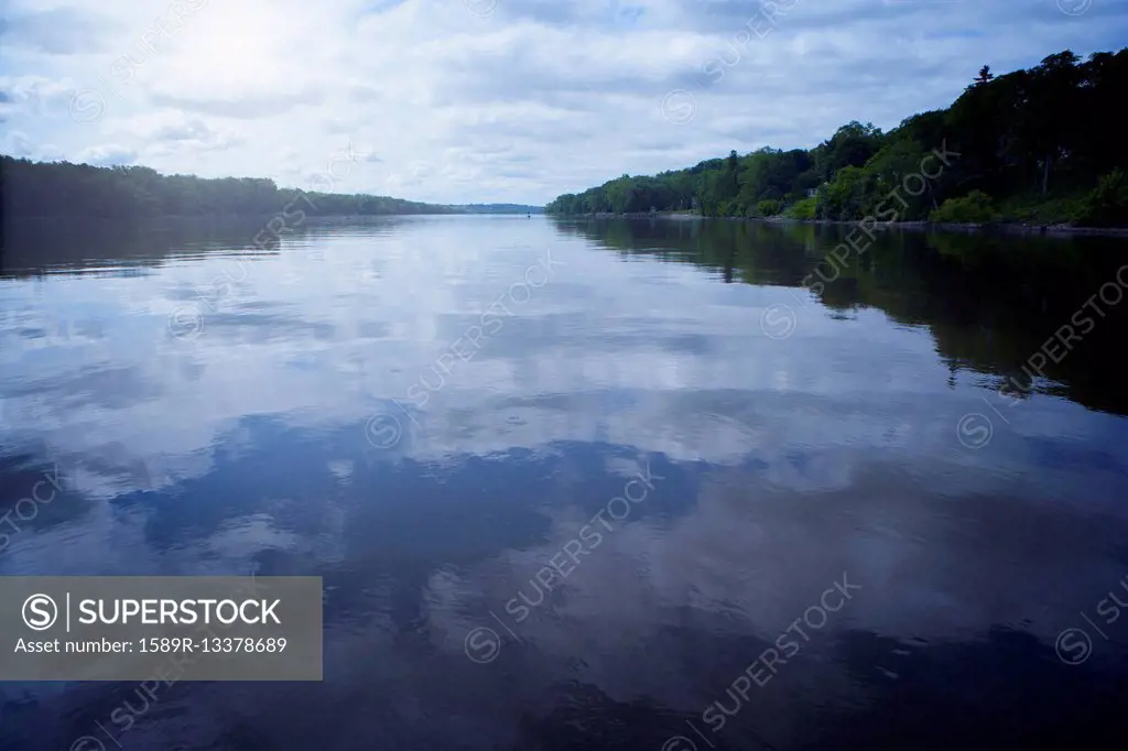 Clouds reflected in still lake, Albany, New York, United States