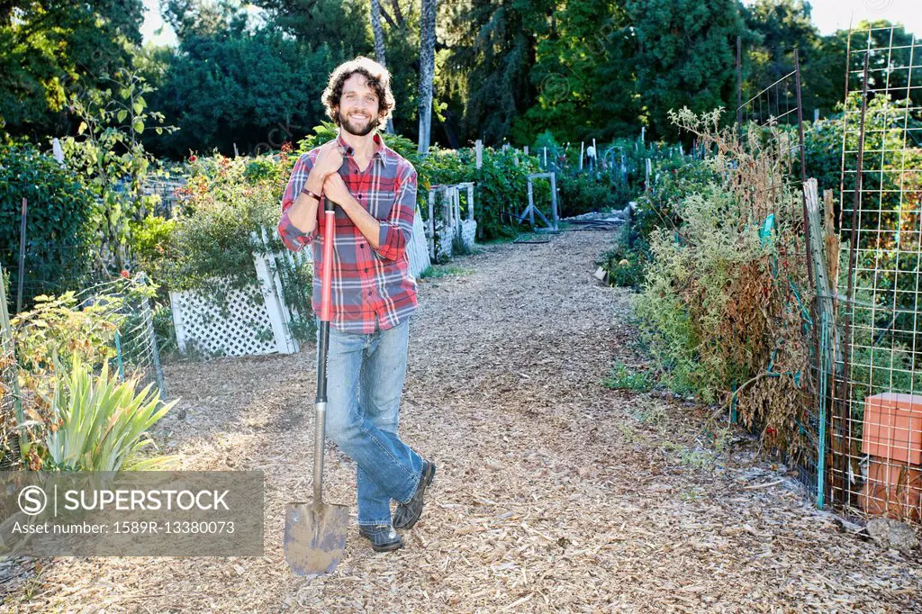 Caucasian man standing in garden