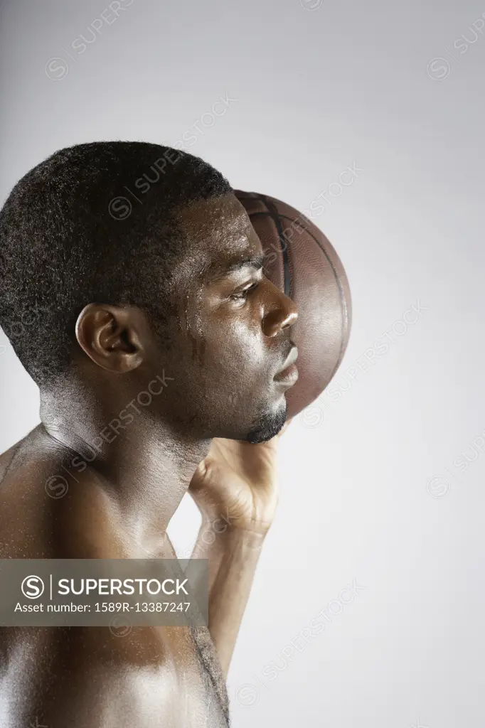 African basketball player holding basketball