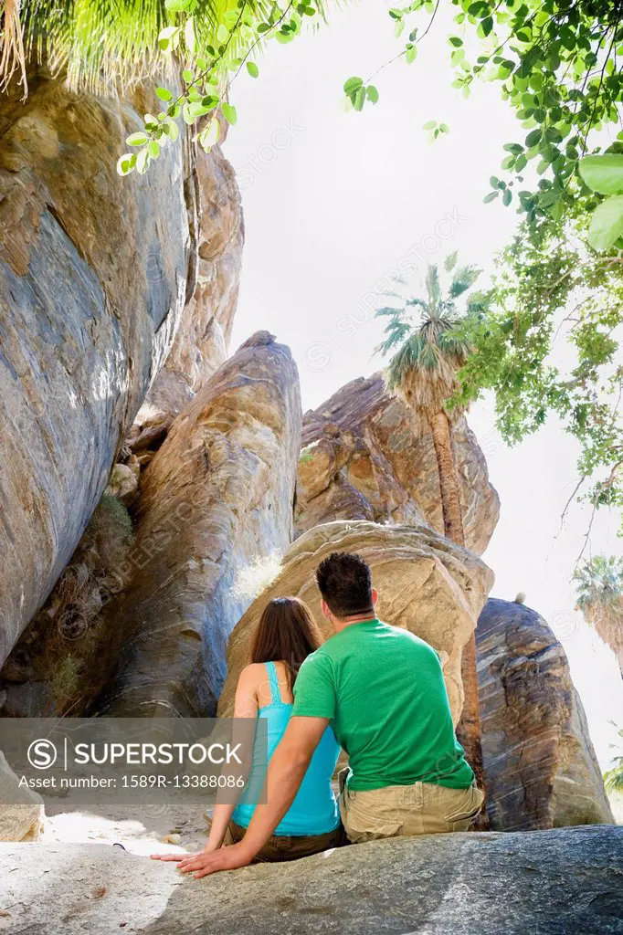 Hispanic couple looking at rock formation