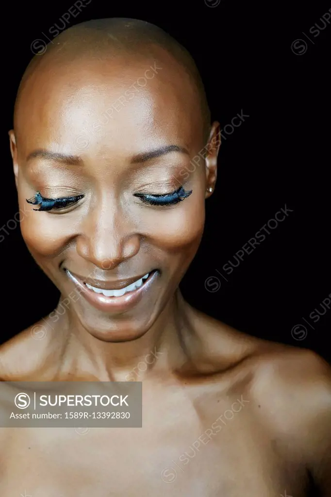 Close up of smiling face African American woman looking down