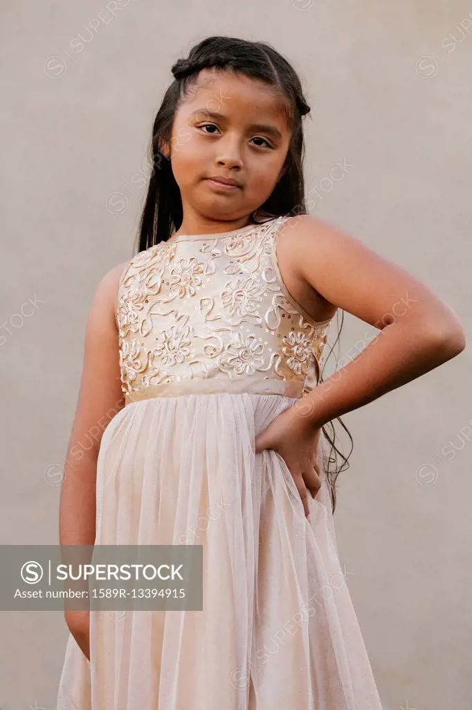 Hispanic girl wearing party dress