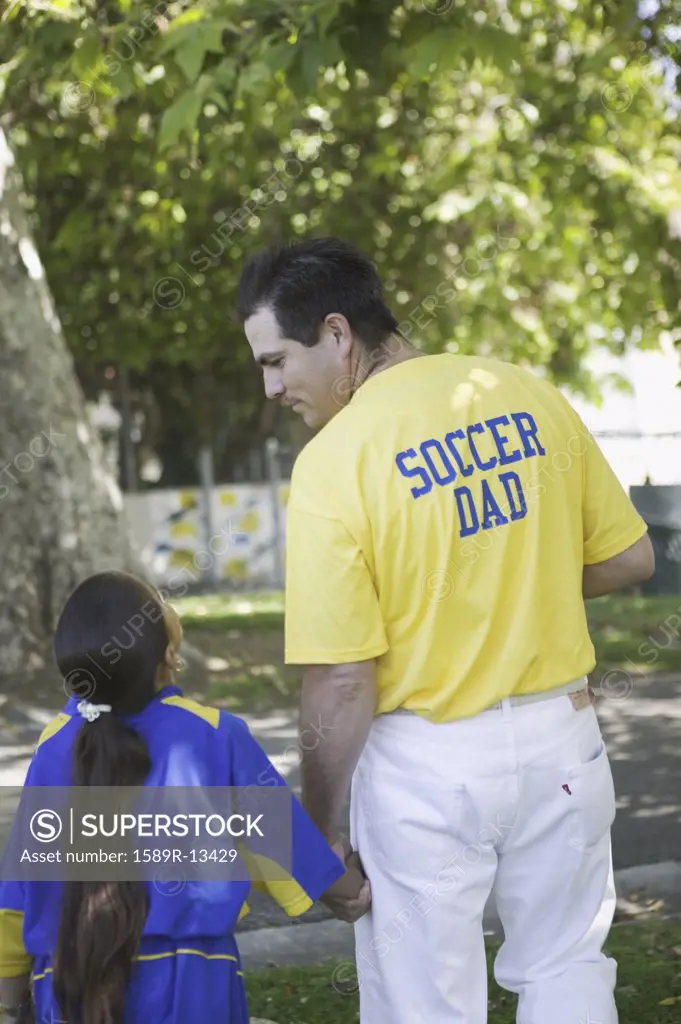 Soccer dad with his daughter