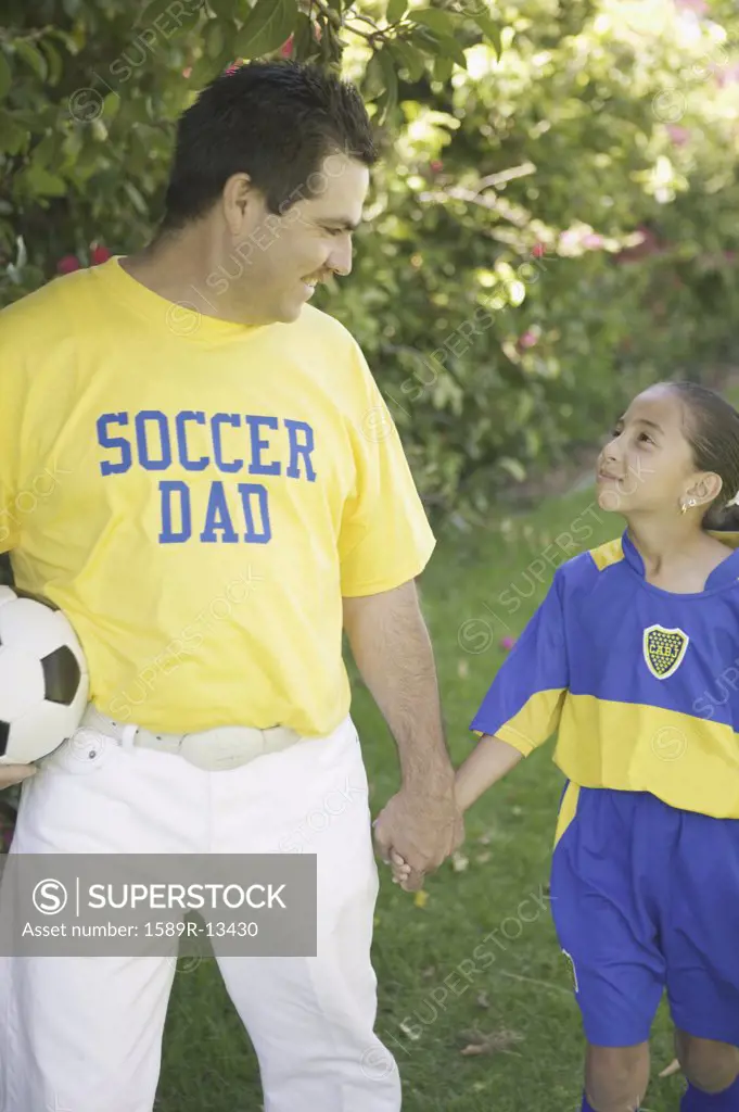 Soccer dad with his daughter