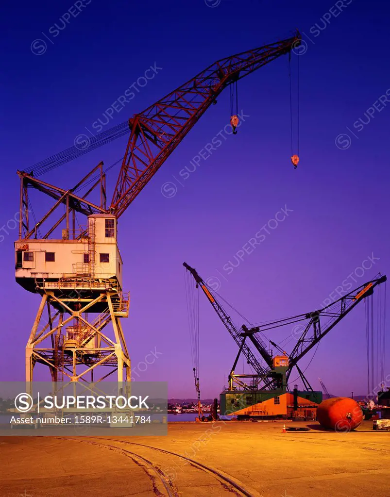 Cranes at harbor at night