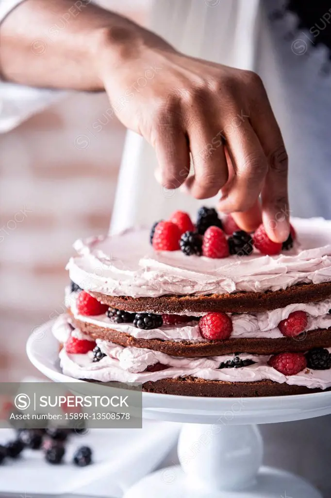 Chocolate cake with berries and cream filling