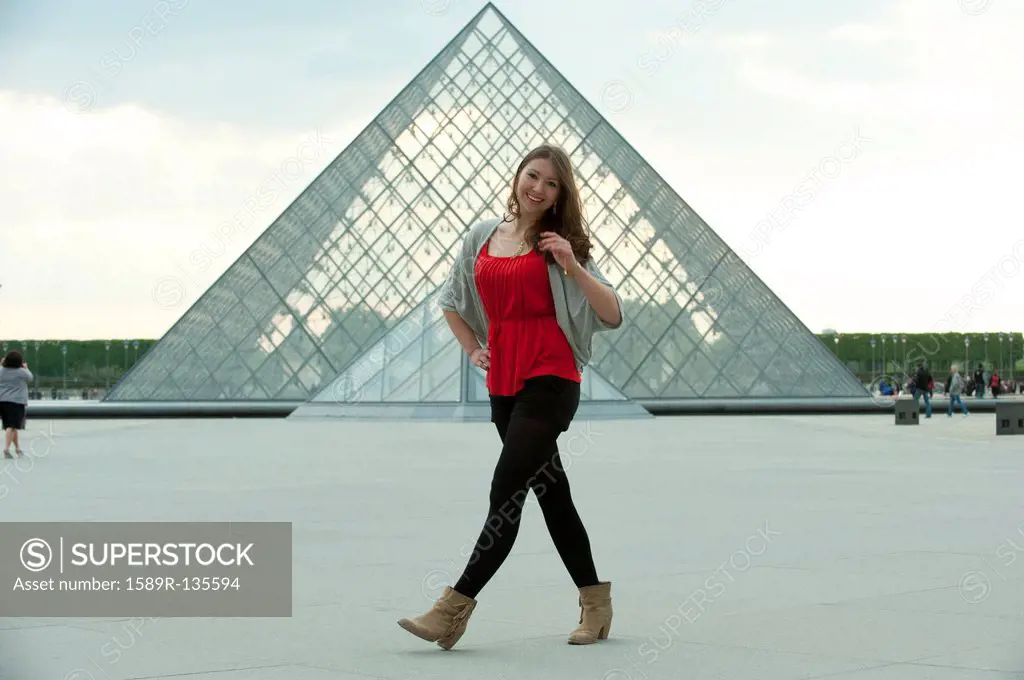 Caucasian woman walking at the Louvre