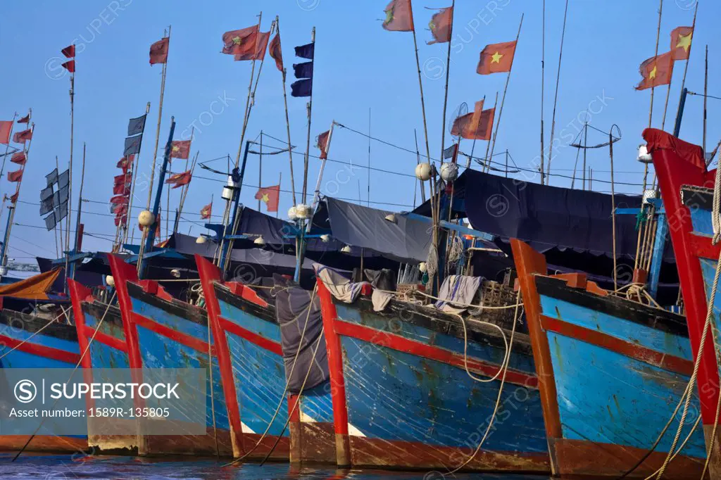 Vietnamese boats moored in harbor