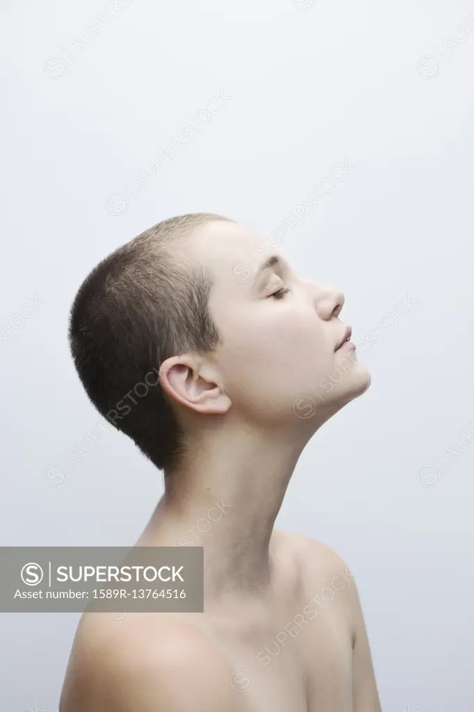 Profile of Caucasian woman with shaved-head