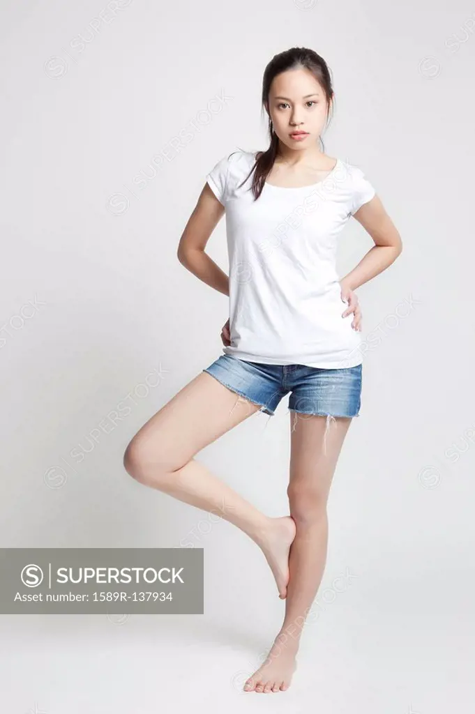 Chinese woman standing on one leg