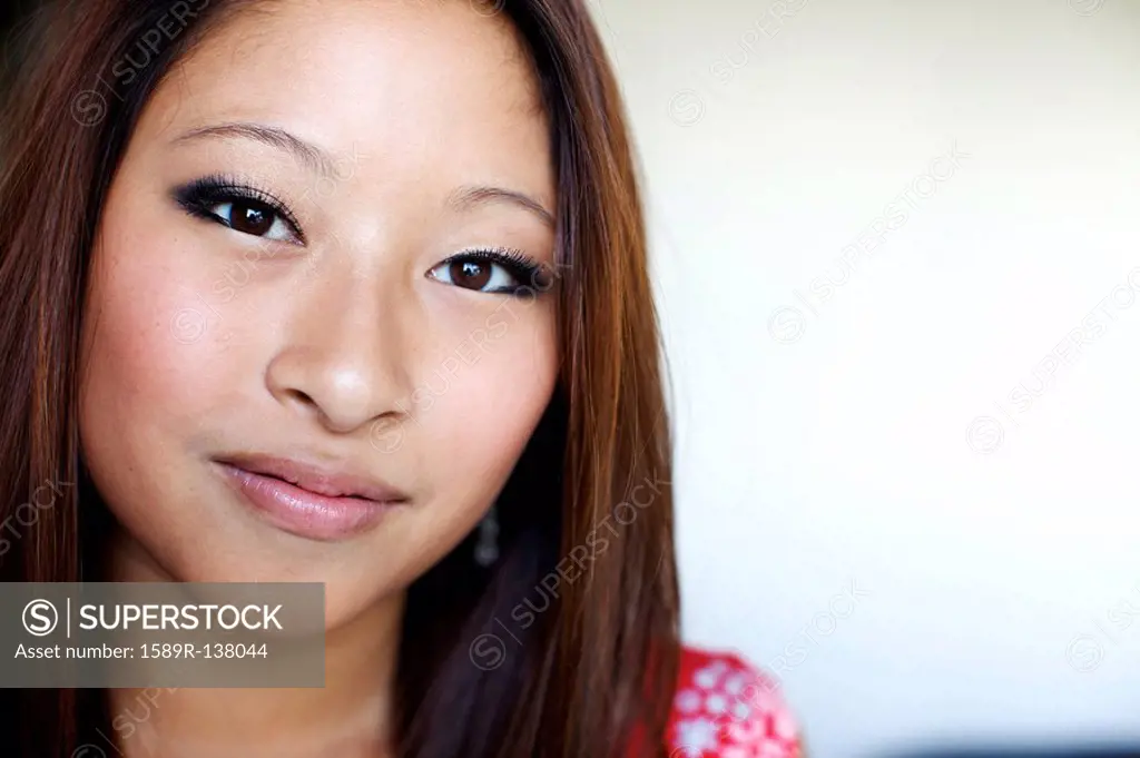 Close up of smiling mixed race teenage girl