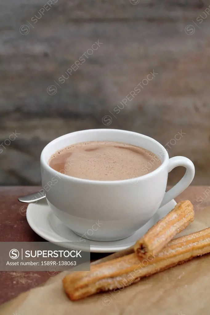 Close up of churros and Mexican hot chocolate