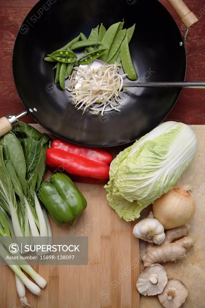 Variety of Asian stir fry ingredients and wok