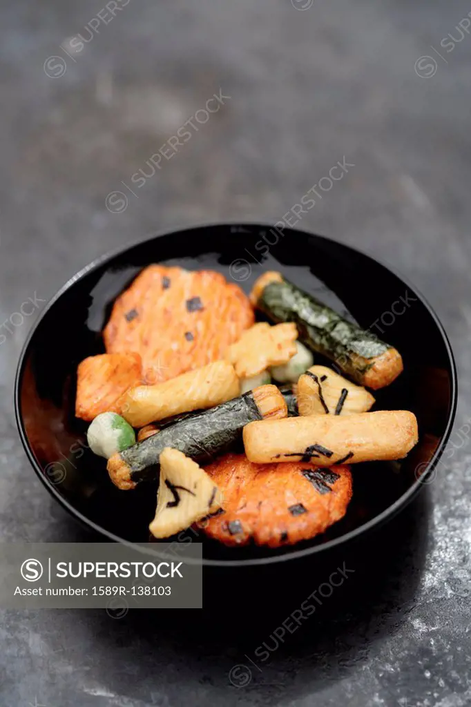 Close up of Japanese rice crackers in bowl