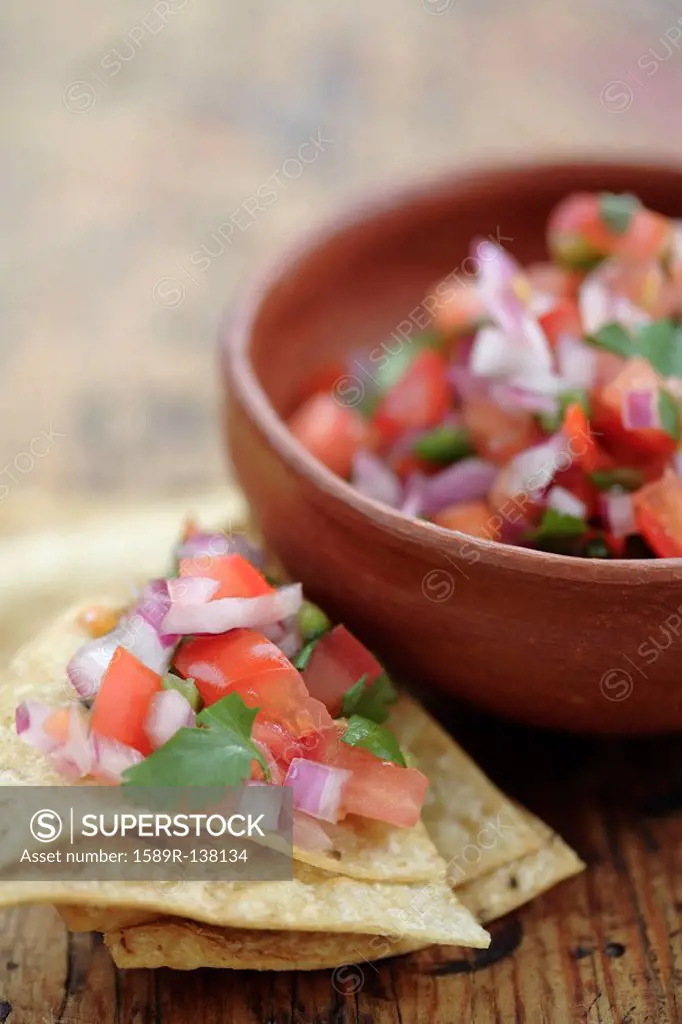 Salsa fresca in bowl and on tortilla chip