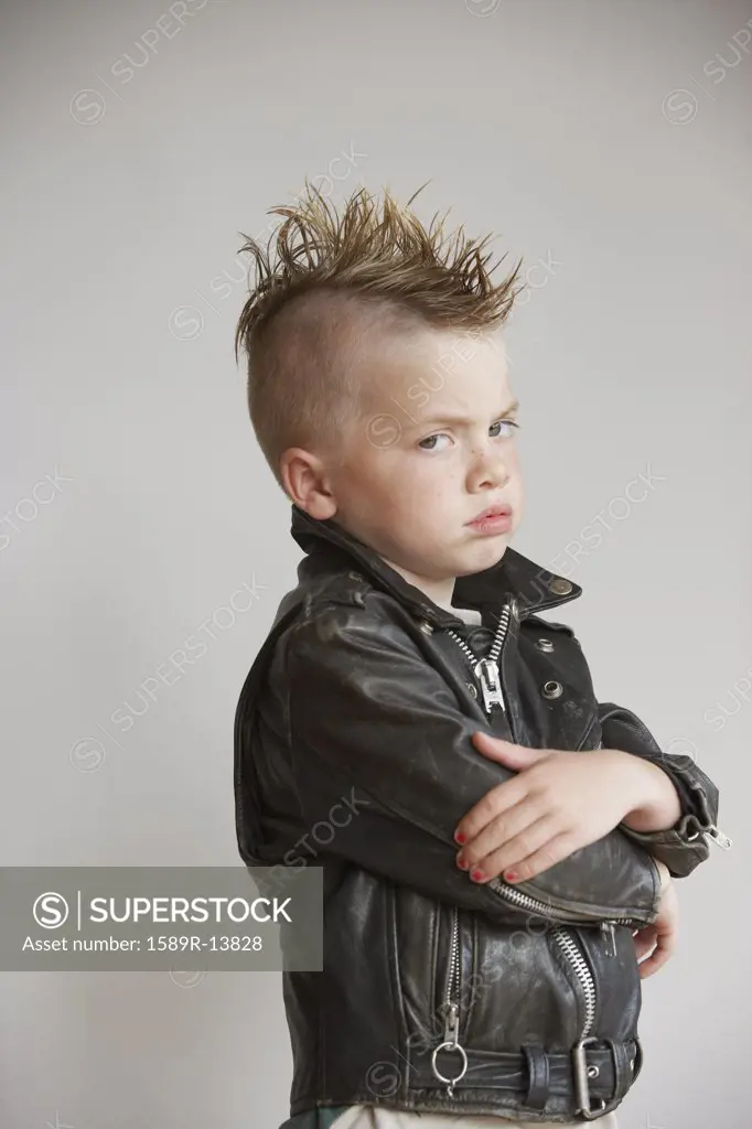 Portrait of boy with mohawk in leather jacket