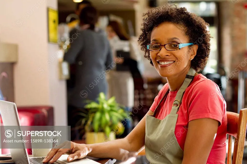 African American small business owner in shop